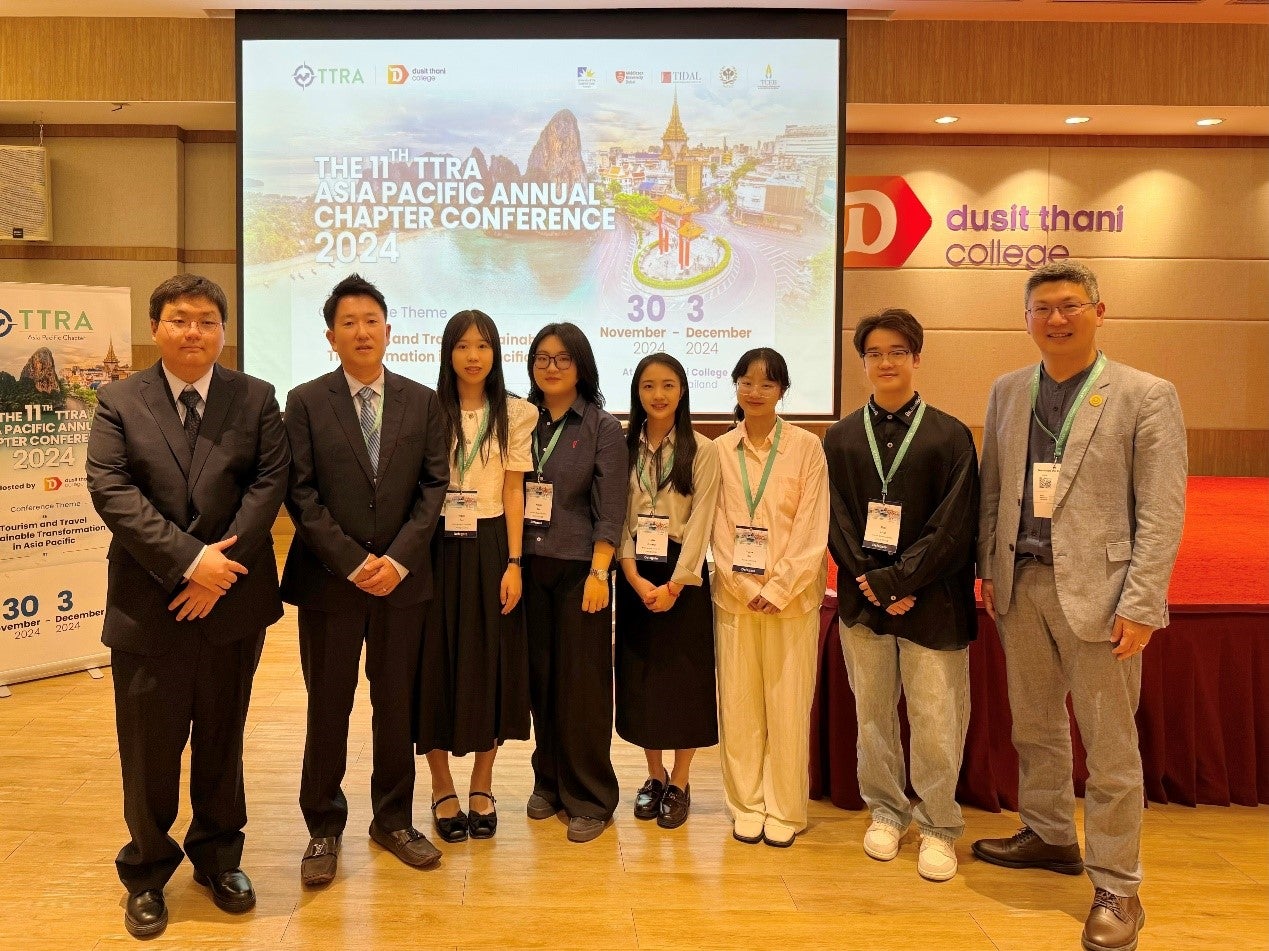 Group of faculty and students at a conference