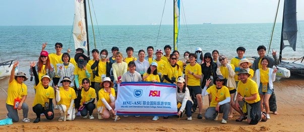 Group of HAIC students in from of Ocean