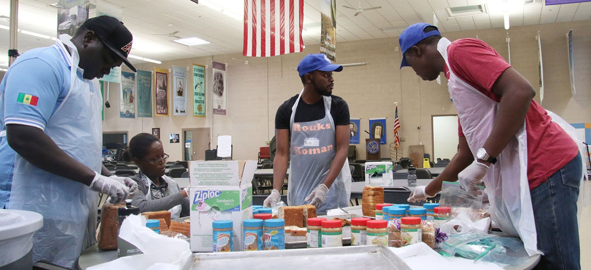 Mandela Washington Fellows making and packaging sandwiches for St. Vincent de Paul to distribute to those in need